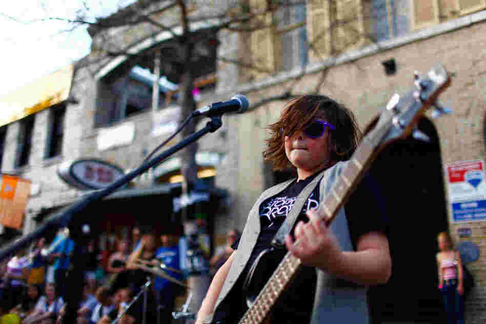 Start 'em young: Christian Brothers, from L.A., plays in the middle of the street during SXSW.