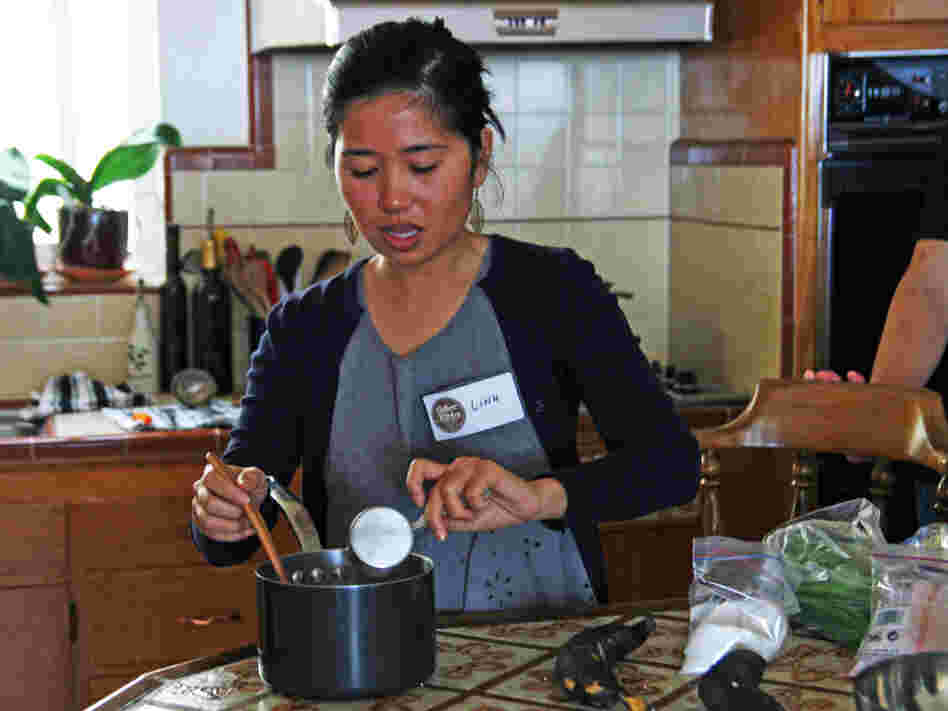  Linh Nguyen teaches the traditional Vietnamese recipes she learned from her mother and aunts to students at a Culture Kitchen class. 