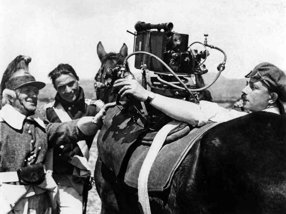 To meet Gance's demands for shooting chase scenes, Simone Feldman (right) used steam engine technology and compressed air to power the mounted cameras. To meet Gance's demands for shooting chase scenes, Simone Feldman (right) used steam engine technology and compressed air to power the mounted cameras.