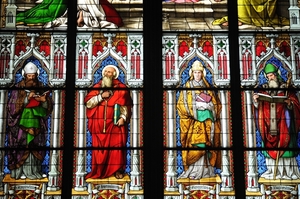 These stained glass church windows decorate the walls of the Cologne Cathedral in Germany.