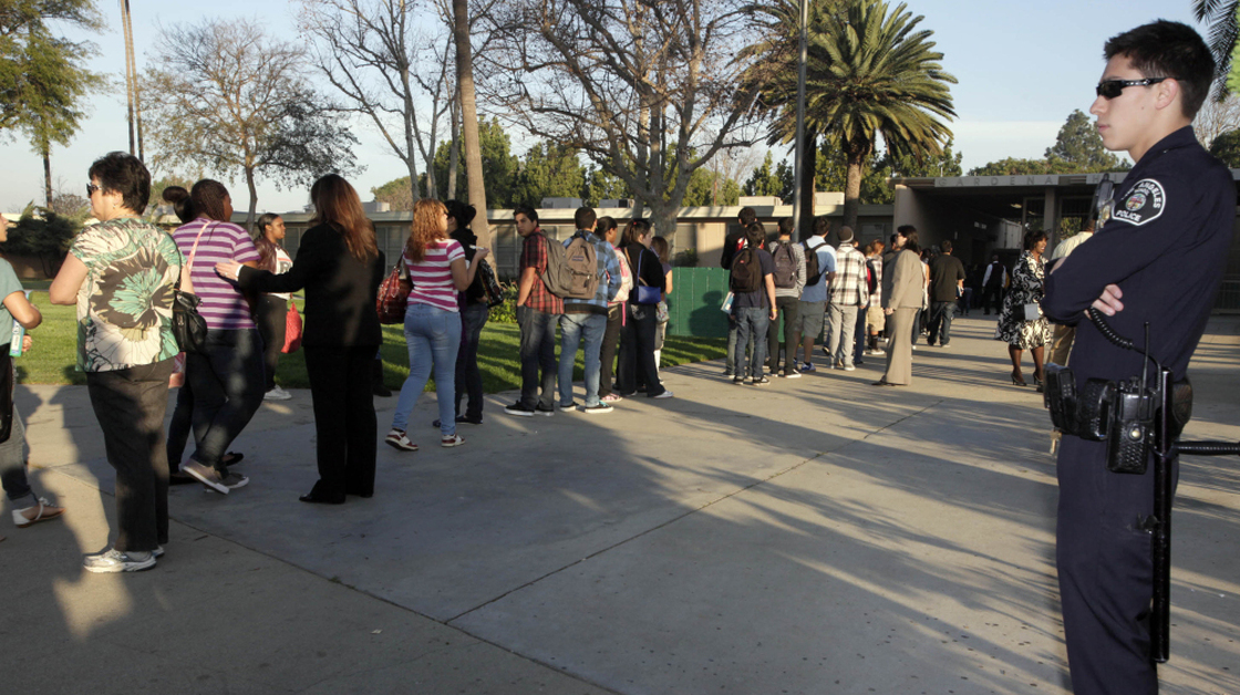 Students at Gardena High School  in Gardena, Calif., lined up for a security check before school in January 2011.
