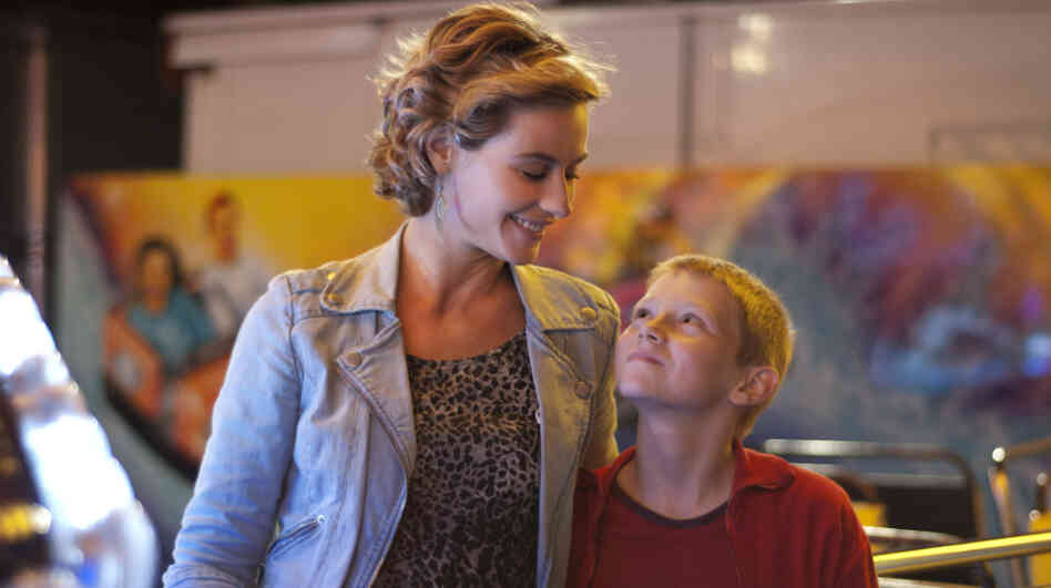 Cyril (Thomas Doret), living in a state-run home and searching for the father who abandoned him, finds a meaningful connection with local hairdresser Samantha (Cecile de France), who agrees to foster him on weekends. Cyril (Thomas Doret), living in a state-run home and searching for the father who abandoned him, finds a meaningful connection with local hairdresser Samantha (Cecile de France), who agrees to foster him on weekends.