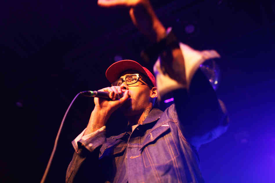 Surrounded by a lively and crackling band, Sugar Tongue Slim cut a smiling and conspiratorial figure on stage at NPR Music's SXSW day party.