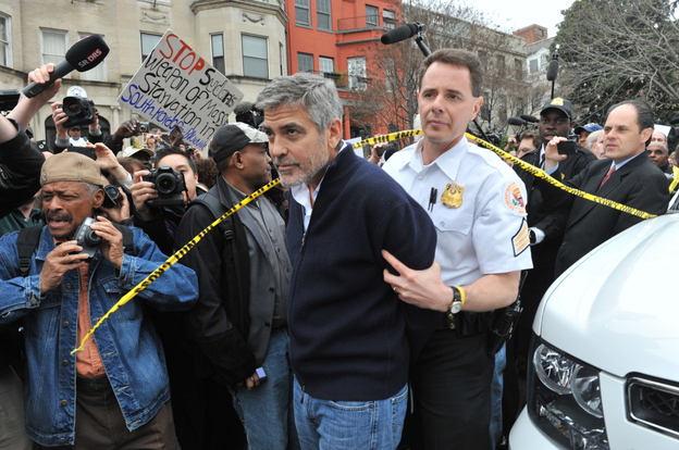 Actor George Clooney is led away in handcuffs from Sudan's embassy in Washington, D.C., on Friday. Clooney, his father, Nick, and others including Democratic Rep. Jim Moran of Virginia and NAACP President Ben Jealous, were arrested as they demonstrated to bring attention to the humanitarian crisis in Sudan. Actor George Clooney is led away in handcuffs from Sudan's embassy in Washington, D.C., on Friday. Clooney, his father, Nick, and others including Democratic Rep. Jim Moran of Virginia and NAACP President Ben Jealous, were arrested as they demonstrated to bring attention to the humanitarian crisis in Sudan.