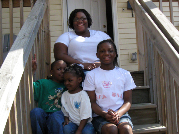 Tamika Rhodes and her children (clockwise) Taneea, Takeema and Paul at their home in St. Paul, Minn. Rhodes says the house is more important to her as a source of stability than as an investment.