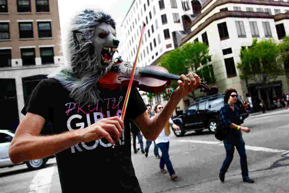 This poor guy really wanted to premiere his solo piece for violin and wolf mask, 'Lycanthropic Tendencies,' at an official SXSW showcase, but settled for the spot where A$AP Rocky marked his territory the night before.