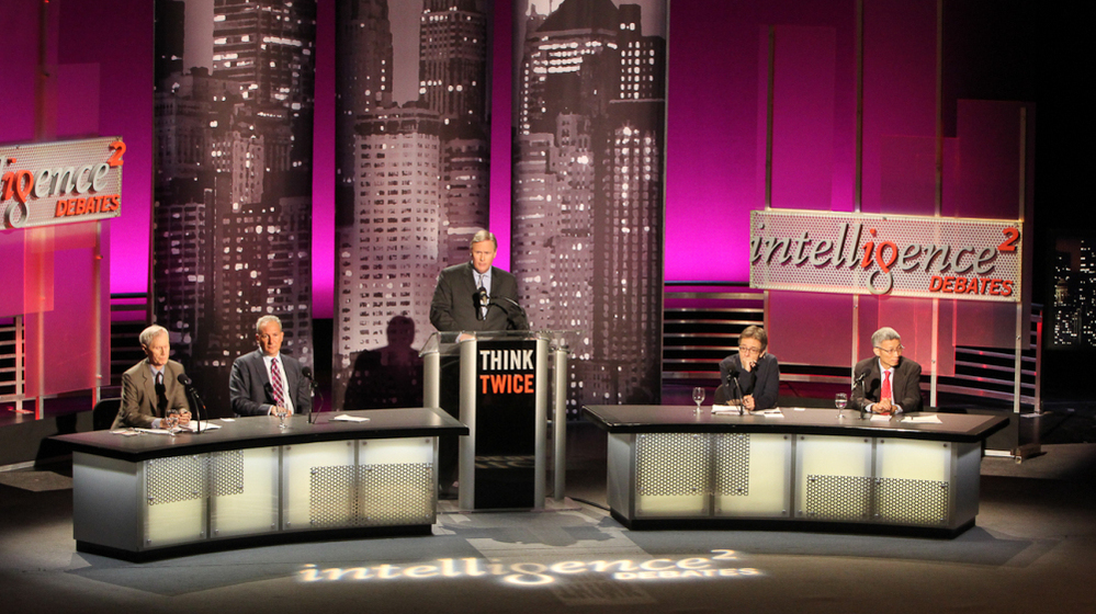 Orville Schell (from left), Peter Schiff, moderator John Donvan, Ian Bremmer and Minxin Pei speak before an audience in New York on the motion "China Does Capitalism Better Than America."