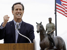 Standing in front of a statue of Ronald Reagan on horseback, Rick Santorum speaks at a campaign rally Monday in Dixon, Ill. Standing in front of a statue of Ronald Reagan on horseback, Rick Santorum speaks at a campaign rally Monday in Dixon, Ill.