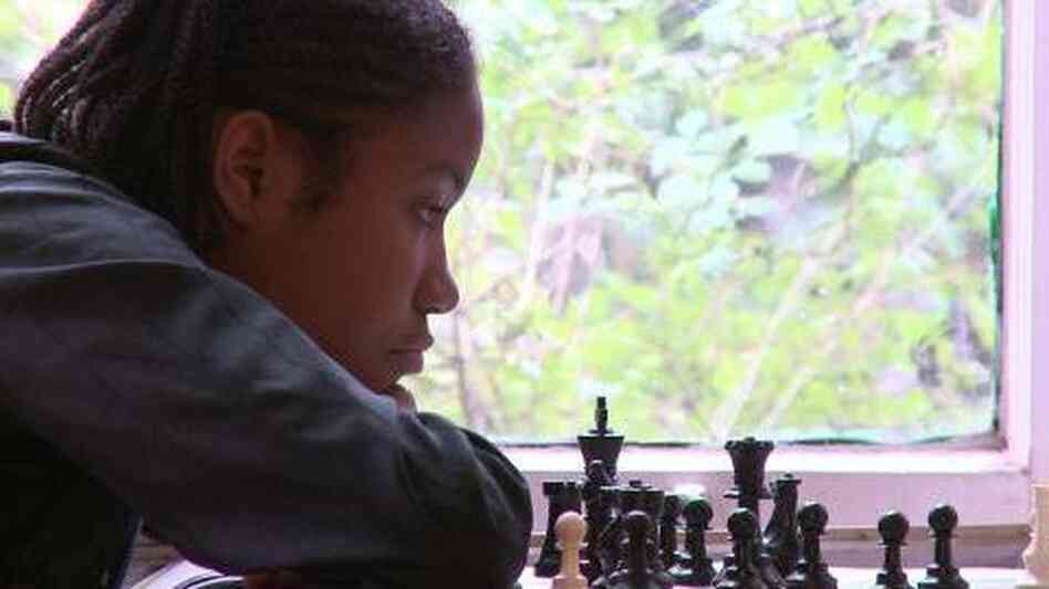 Rochelle, one of the kids in Brooklyn Castle, examines a chess board. Rochelle, one of the kids in Brooklyn Castle, examines a chess board.