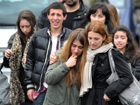 Young people walk away from the Ozar Hatorah Jewish school, on Monday in Toulouse, southwestern France, where at least four people (three of them children) were killed and one seriously wounded when a gunman opened fire. It was the third gun attack in a week by a man who fled on a motorbike. Young people walk away from the Ozar Hatorah Jewish school, on Monday in Toulouse, southwestern France, where at least four people (three of them children) were killed and one seriously wounded when a gunman opened fire. It was the third gun attack in a week by a man who fled on a motorbike.