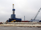 A drilling rig sits on Oooguruk Island off the coast of Alaska's North Slope. The 6-acre island was built by Pioneer Natural Resources so it could drill for oil on the Arctic Ocean. A drilling rig sits on Oooguruk Island off the coast of Alaska's North Slope. The 6-acre island was built by Pioneer Natural Resources so it could drill for oil on the Arctic Ocean.