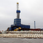  A drilling rig sits on Oooguruk Island off the coast of Alaska's North Slope. The 6-acre island was built by Pioneer Natural Resources so it could drill for oil on the Arctic Ocean. 