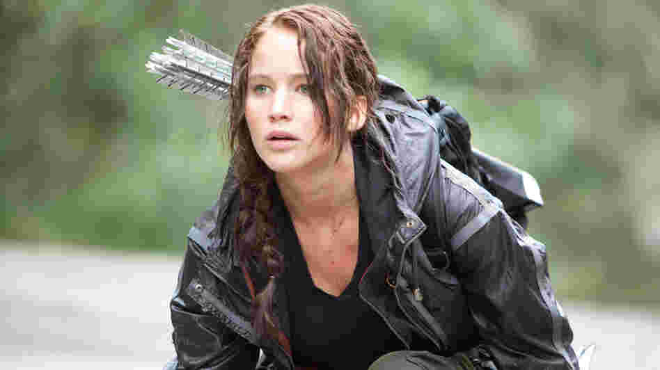 Child soldier: Hunger Games heroine Katniss Everdeen (Jennifer Lawrence) has one thing in common with real-life underage combatants in our world: an impoverished background that makes kids easy prey.