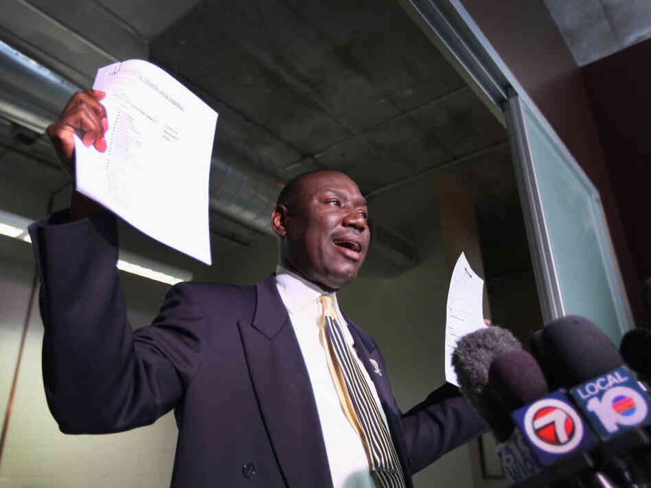 Attorney Benjamin Crump speaks to the medial, holding cellphone records and a police report. He represents the family of 17-year-old Trayvon Martin, who was was killed by neighborhood watch volunteer George Zimmerman on Feb. 26 in Sanford, Fla.