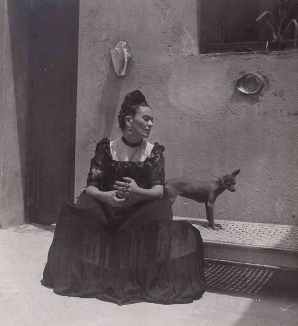 Frida Kahlo seated with dog, circa 1944. 