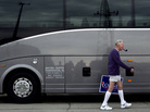 Jim Wilson of Buckingham, Va., who supports Republican presidential candidate Mitt Romney, walks past a bus during a Romney campaign stop Monday in Springfield, Ill. Jim Wilson of Buckingham, Va., who supports Republican presidential candidate Mitt Romney, walks past a bus during a Romney campaign stop Monday in Springfield, Ill.