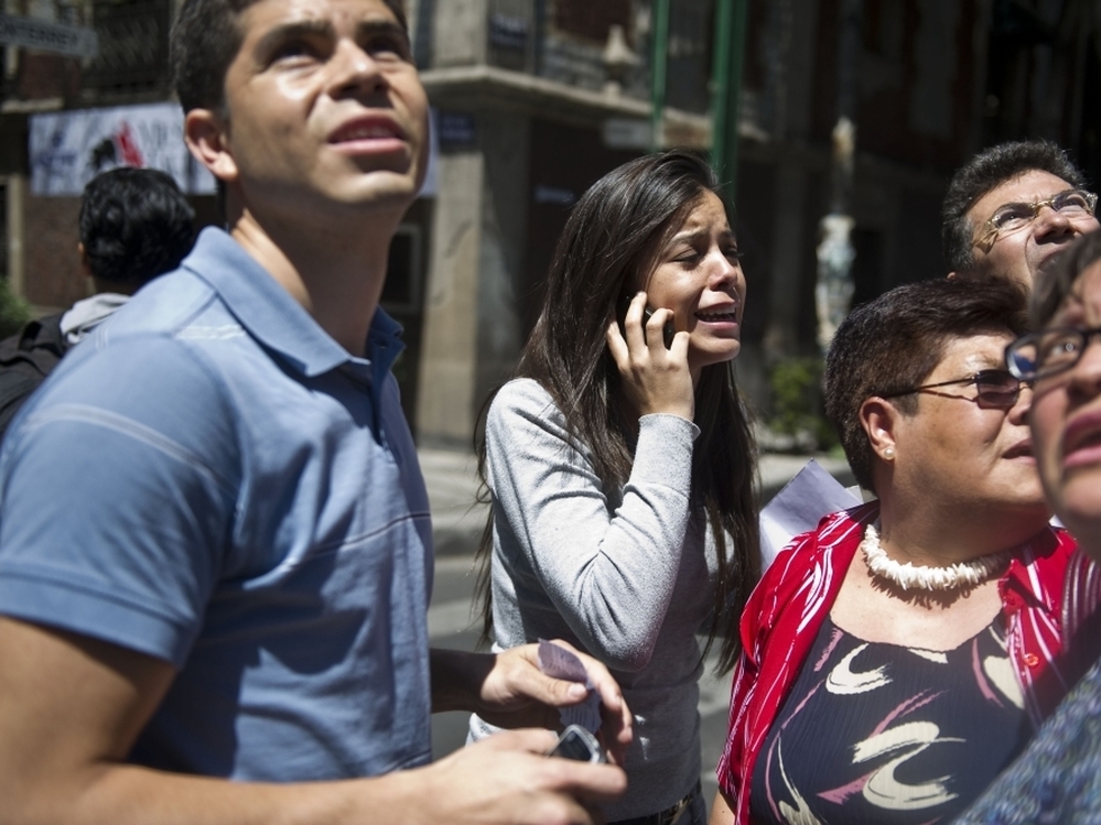 Many people went into the streets after the strong quake rocked Mexico City. 