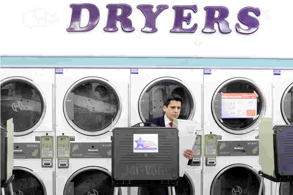 A voter prepares to cast his vote in the state primary at a laundromat in Chicago. There are 54 GOP delegates up for grabs in Illinois. 