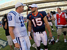 Former Indianapolis quarterback Peyton Manning (left) talks with Tim Tebow of the Denver Broncos in 2010. Manning will be taking Tebow's job. Former Indianapolis quarterback Peyton Manning (left) talks with Tim Tebow of the Denver Broncos in 2010. Manning will be taking Tebow's job.