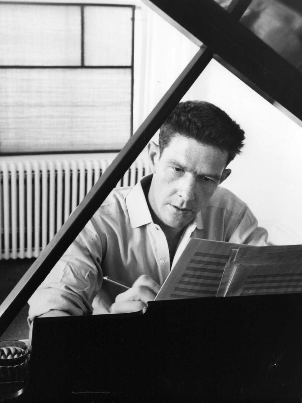 American composer, John Cage, works at his piano in 1947. Marking the centennial of his birth, the Berliner Festispiele is exploring Cage's legacy under the theme "Cage and Consequences."