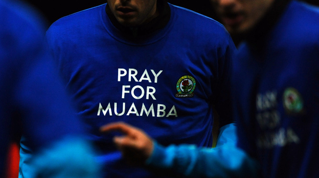Blackburn Rovers players wear T-shirts in support of Bolton Wanderers' midfielder Fabrice Muamba.