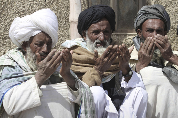 Afghan villagers prayed last week at a ceremony for the 16 victims of what officials say was an attack by a U.S. Army soldier. 