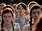 In The Hunger Games, Katniss Everdeen (Jennifer Lawrence) volunteers to take her little sister's place in a killing ritual televised to the masses. In The Hunger Games, Katniss Everdeen (Jennifer Lawrence) volunteers to take her little sister's place in a killing ritual televised to the masses.