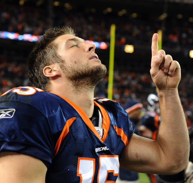  Tebow celebrates after the game against the New York Jets on Nov. 17, 2011 in Denver. 