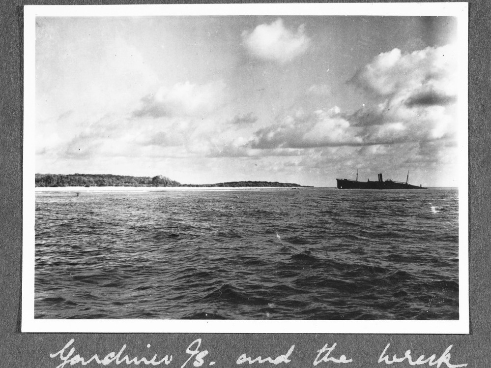 This image was provided by The International Group for Historic Aircraft Recovery. Taken in late 1937 off the South Pacific island of Nikumaroro, it interests investigators because of the object on the left side of the photo. Something is sticking out of the water. Enhanced analysis indicates that could be part of Amelia Earhart's plane, investigators say. 