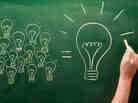 light bulbs sketched on chalkboard Many small ideas make a big one