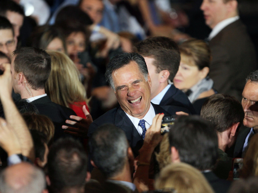 Mitt Romney greets supporters during an Illinois GOP primary victory party in Schaumburg. 