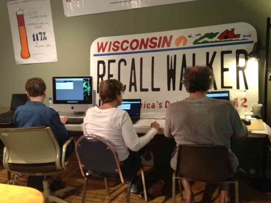 Volunteers at the Wisconsin Democratic Party's recall office in Waukesha entered names from petitions to recall Gov. Scott Walker into their voter databases on March 20.