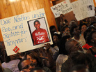 Civil rights leaders and residents of Sanford, Fla., attend a meeting Tuesday to discuss the death of Trayvon Martin, who was shot by a neighborhood watch captain. The Justice Department and the FBI opened an investigation into the shooting, and the local state attorney announced that he had asked a grand jury to investigate. Civil rights leaders and residents of Sanford, Fla., attend a meeting Tuesday to discuss the death of Trayvon Martin, who was shot by a neighborhood watch captain. The Justice Department and the FBI opened an investigation into the shooting, and the local state attorney announced that he had asked a grand jury to investigate.
