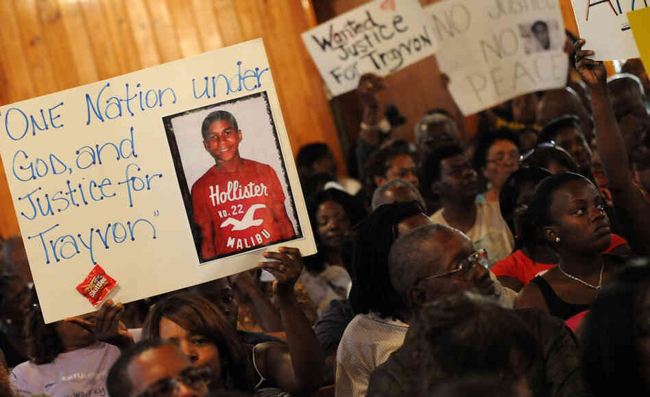 Civil rights leaders and residents of Sanford, Fla., attend a meeting Tuesday to discuss the death of Trayvon Martin, who was shot by a neighborhood watch captain. The Justice Department and the FBI opened an investigation into the shooting, and the local state attorney announced that he had asked a grand jury to investigate. Civil rights leaders and residents of Sanford, Fla., attend a meeting Tuesday to discuss the death of Trayvon Martin, who was shot by a neighborhood watch captain. The Justice Department and the FBI opened an investigation into the shooting, and the local state attorney announced that he had asked a grand jury to investigate.
