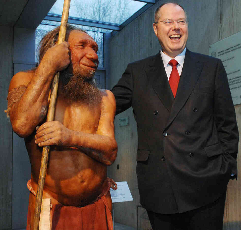 What if we still stood side-by-side? Former German Finance Minister Peer Steinbrueck poses next to a Neanderthal model at the Neanderthal Museum in Mettmann, Germany, in 2007.