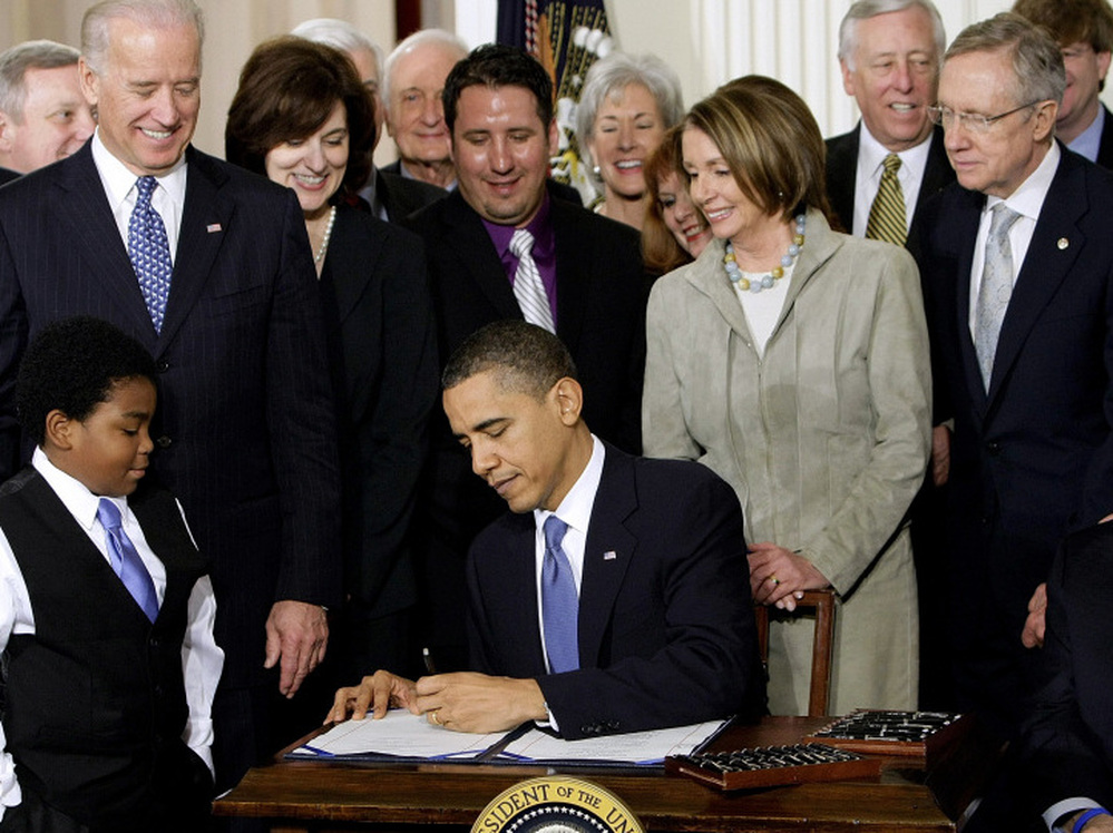 President Obama signs the national health care law at the White House on March 23, 2010.