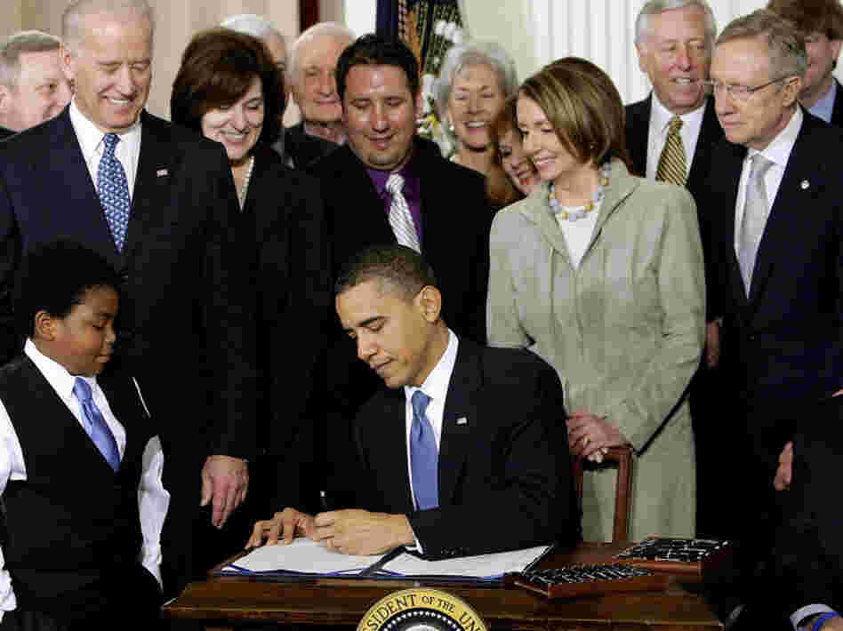 President Obama signs the national health care law at the White House on March 23, 2010.