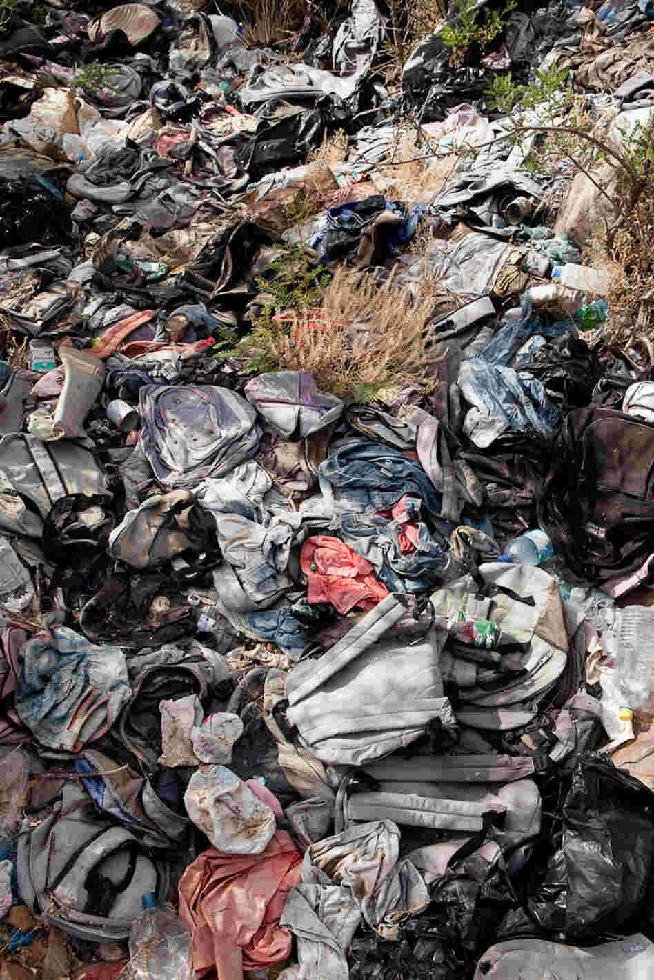 Anthropology professor Jason De Leon says migrants often leave items like backpacks behind in an effort to blend in once they make it to a bigger road or small town. 