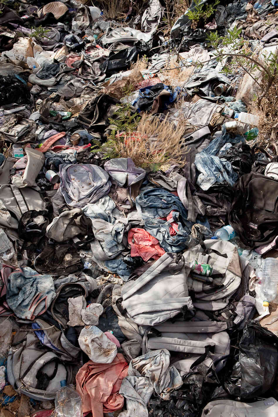 Anthropology professor Jason De Leon says migrants often leave items like backpacks behind in an effort to blend in once they make it to a bigger road or small town. 