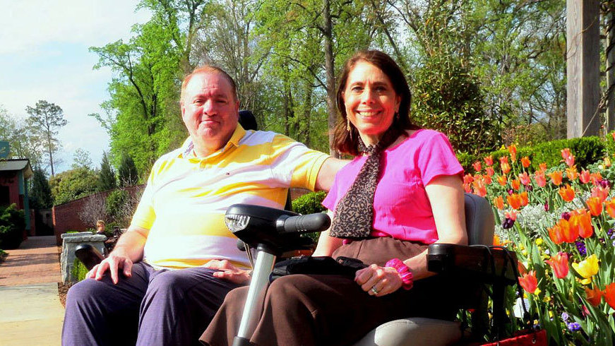 Dorothy Biebrich's red scooter helped Winslow Jackson break the ice with her back in 2006. Today the couple, shown here at the Atlanta Botanical Garden, spend their days having fun together. 