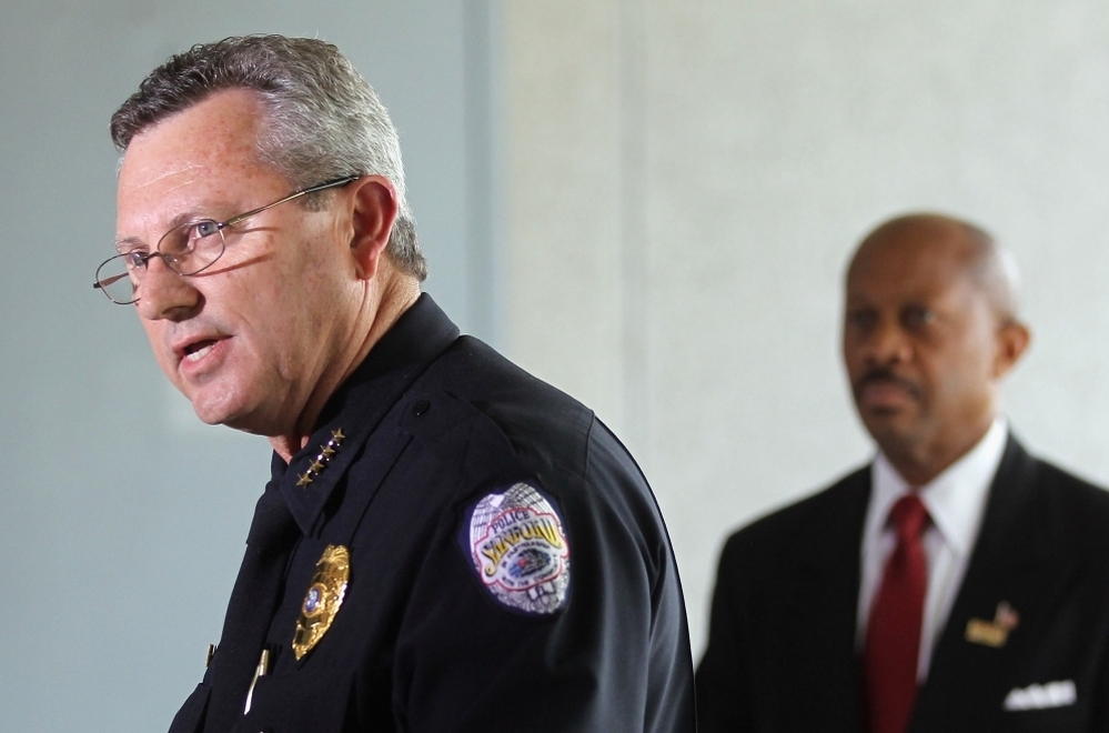 Sanford Police Department Chief Bill Lee (left) announces he will temporarily step down in the wake of the Trayvon Martin killing.
