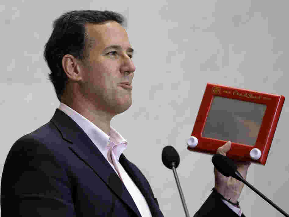 Rick Santorum beats up Mitt Romney with an Etch A Sketch, figuratively speaking. 