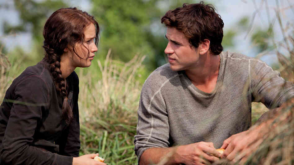 Jennifer Lawrence stars as Katniss Everdeen in The Hunger Games, adapted from Suzanne Collins' bestselling novel trilogy. Jennifer Lawrence stars as Katniss Everdeen in The Hunger Games, adapted from Suzanne Collins' bestselling novel trilogy.