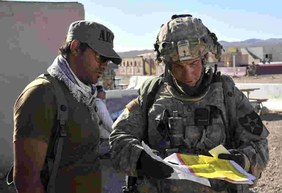This August 23, 2011 photograph obtained courtesy of the Defense Video & Imagery Distribution System (DVIDS) shows Staff Sgt. Robert Bales (right) at the National Training Center in Fort Irwin, California. (Note at 10:50 p.m. ET: Earlier, we mistakenly said he was on the left.)