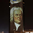 A portrait of Bach, projected in December 2005 on a skyscraper in his longtime home city of Leipzig, Germany. A portrait of Bach, projected in December 2005 on a skyscraper in his longtime home city of Leipzig, Germany.