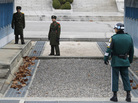 With a new leader in North Korea, the U.S. and South Korea are watching for clues of his policies. But so far tensions have not eased along the demilitarized zone. Here, two North Korean soldiers look across at a South Korean soldier on Dec. 2. With a new leader in North Korea, the U.S. and South Korea are watching for clues of his policies. But so far tensions have not eased along the demilitarized zone. Here, two North Korean soldiers look across at a South Korean soldier on Dec. 2.