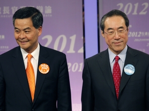 Former convener of Hong Kong's Executive Council Leung Chun-ying (left) and former Hong Kong Chief Secretary Henry Tang (shown here March 16) are the leading candidates to be Hong Kong's next leader, who will be chosen March 25 by a Beijing-selected committee. Former convener of Hong Kong's Executive Council Leung Chun-ying (left) and former Hong Kong Chief Secretary Henry Tang (shown here March 16) are the leading candidates to be Hong Kong's next leader, who will be chosen March 25 by a Beijing-selected committee.