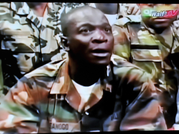 The leader of the junta that seized power in Mali, Army Capt. Amadou Sanogo, announces a curfew in the capital, Bamako, on Thursday, in this photo taken from television.The coup ousted an elected president who was due to step down after a new election next month in the West African nation.