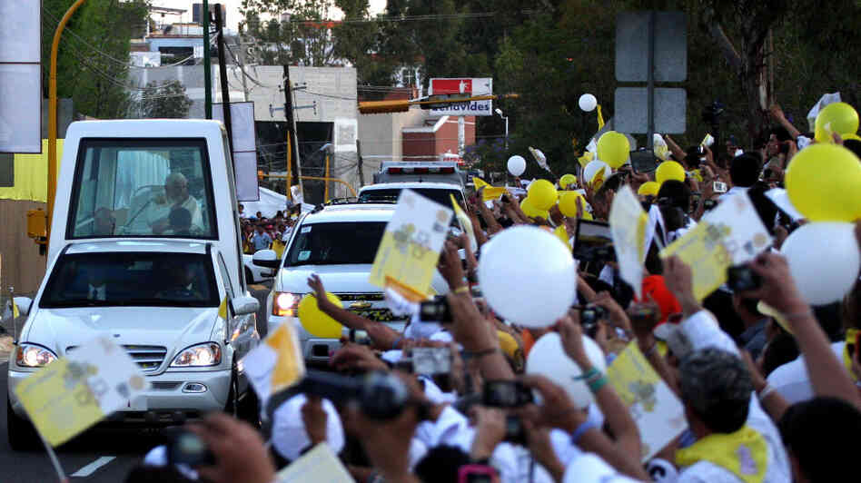 Pope Benedict XVI arrives in his popemobile at Miraflores College in Leon, in the Mexican state of Guanajuato, on Friday.