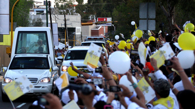 Pope Benedict XVI arrives in his popemobile at Miraflores College in Leon, in the Mexican state of Guanajuato, on Friday. Pope Benedict XVI arrives in his popemobile at Miraflores College in Leon, in the Mexican state of Guanajuato, on Friday.